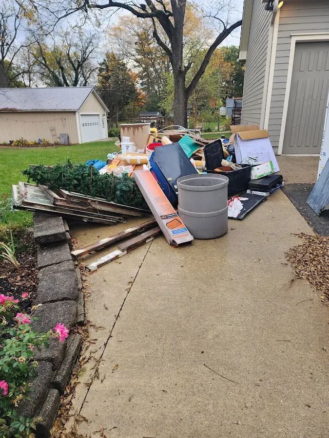 Dumpster being loaded with debris for 30 Yard Dumpster Rental in Mount Carmel